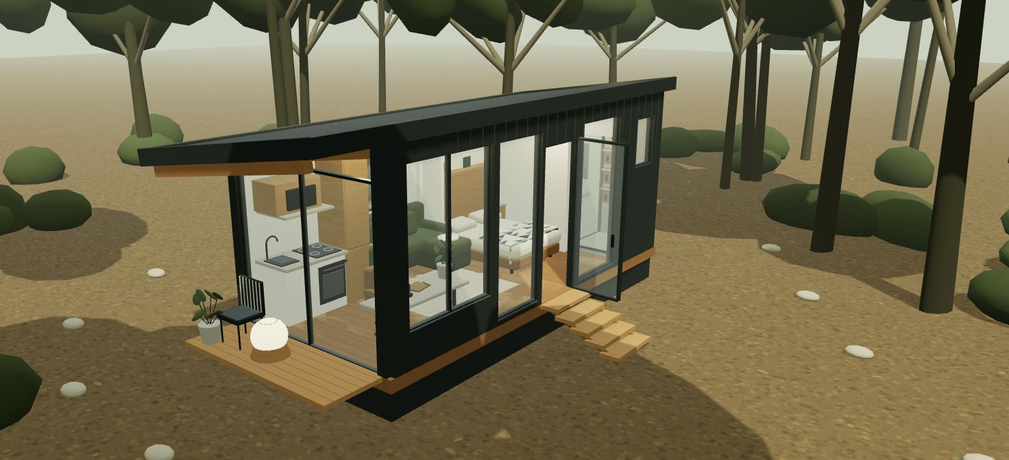 A furnished woodland cabin with large windows and a covered porch